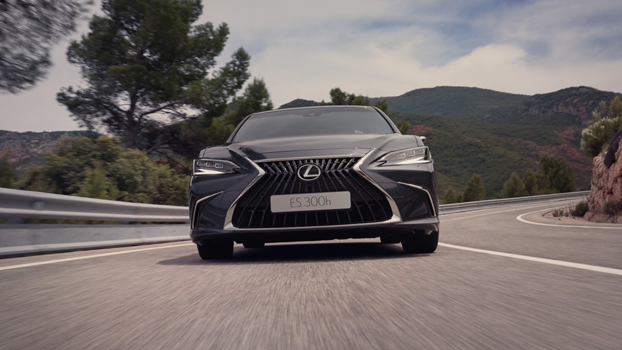 A Lexus ES driving on a road