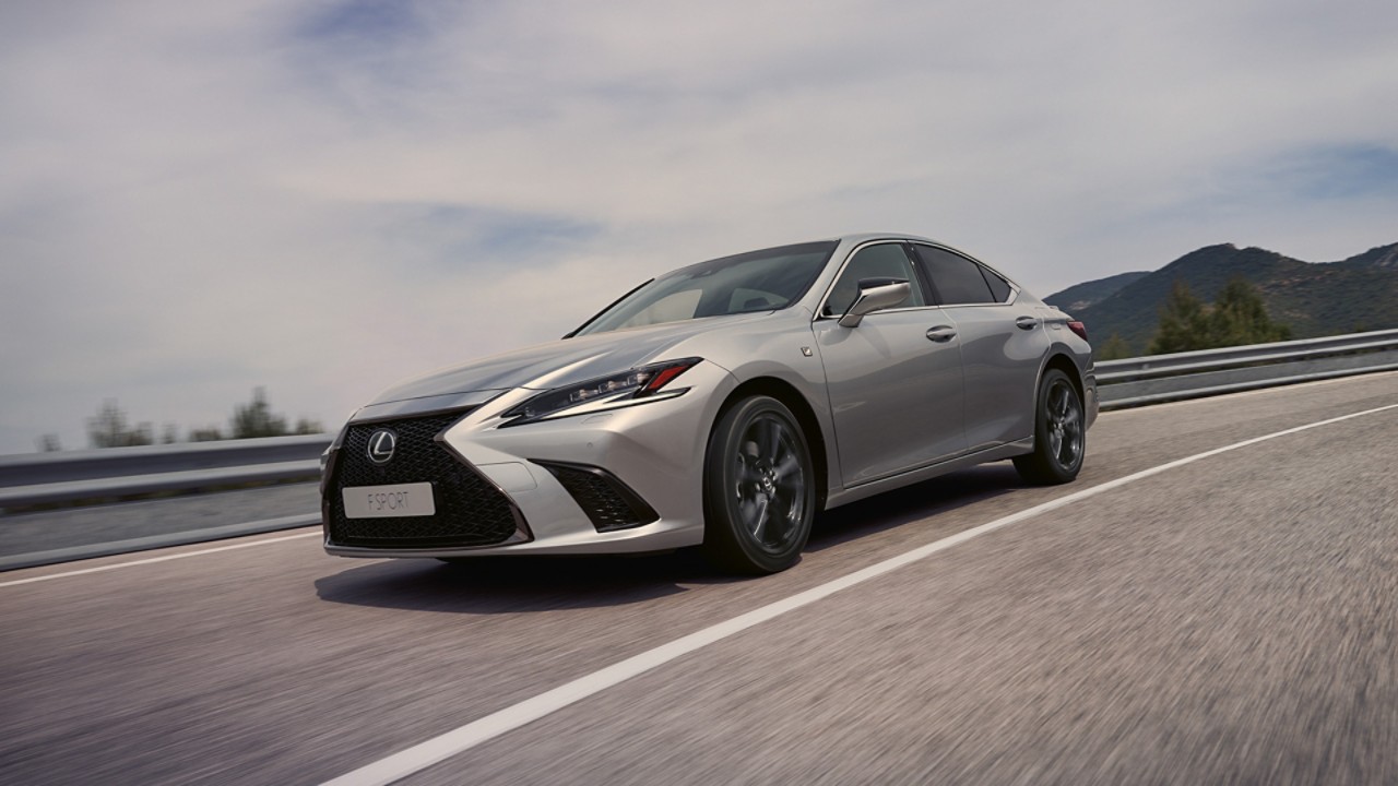 Side view of the Lexus ES driving on a road