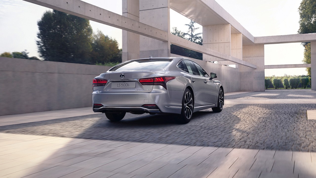 Rear view of the Lexus LS driving 
