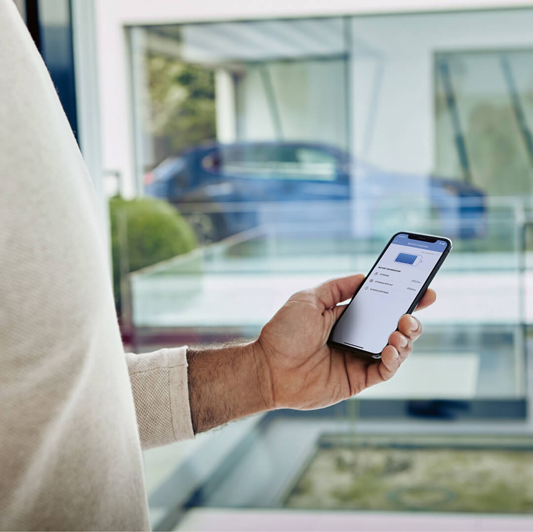 A man using Lexus apps on his mobile phone